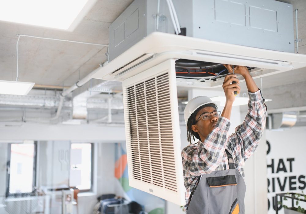 african-american-skilled-technician-repairing-offi-2025-06-06-02-11-27-utc-scaled-1.jpg